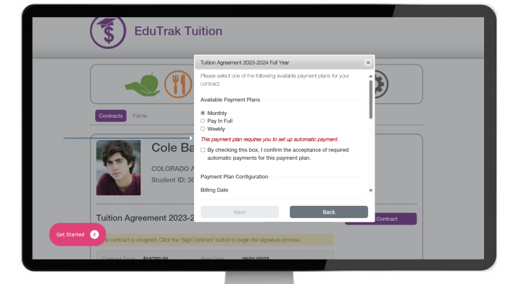 School administrator using tuition billing software on a laptop in a modern office